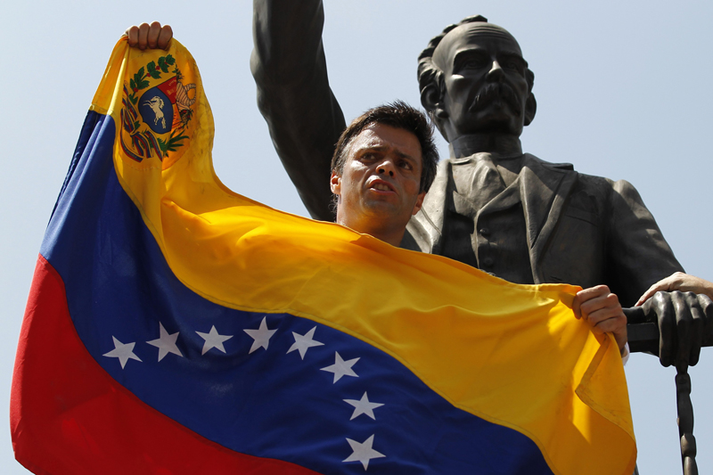 Venezuelan opposition leader Leopoldo Lopez speaks to supporters before handing himself over in Caracas