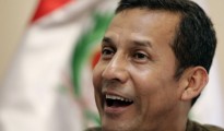 Peru's opposition leader and ex-army officer Humala smiles during interview with Reuters in Lima