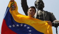 Venezuelan opposition leader Leopoldo Lopez speaks to supporters before handing himself over in Caracas